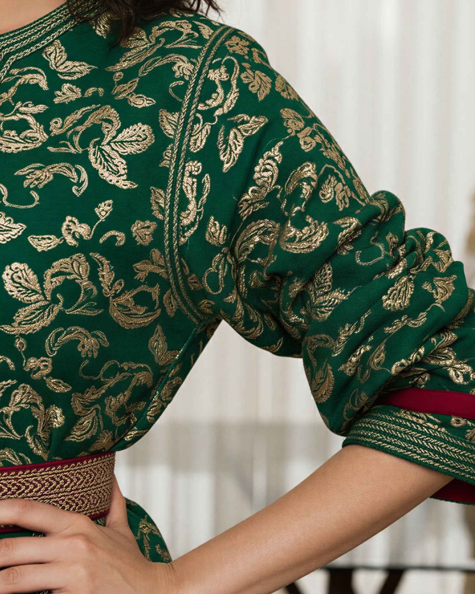 Ivory Dawn kaftan puffed sleeve detail with gold embroidery on green fabric