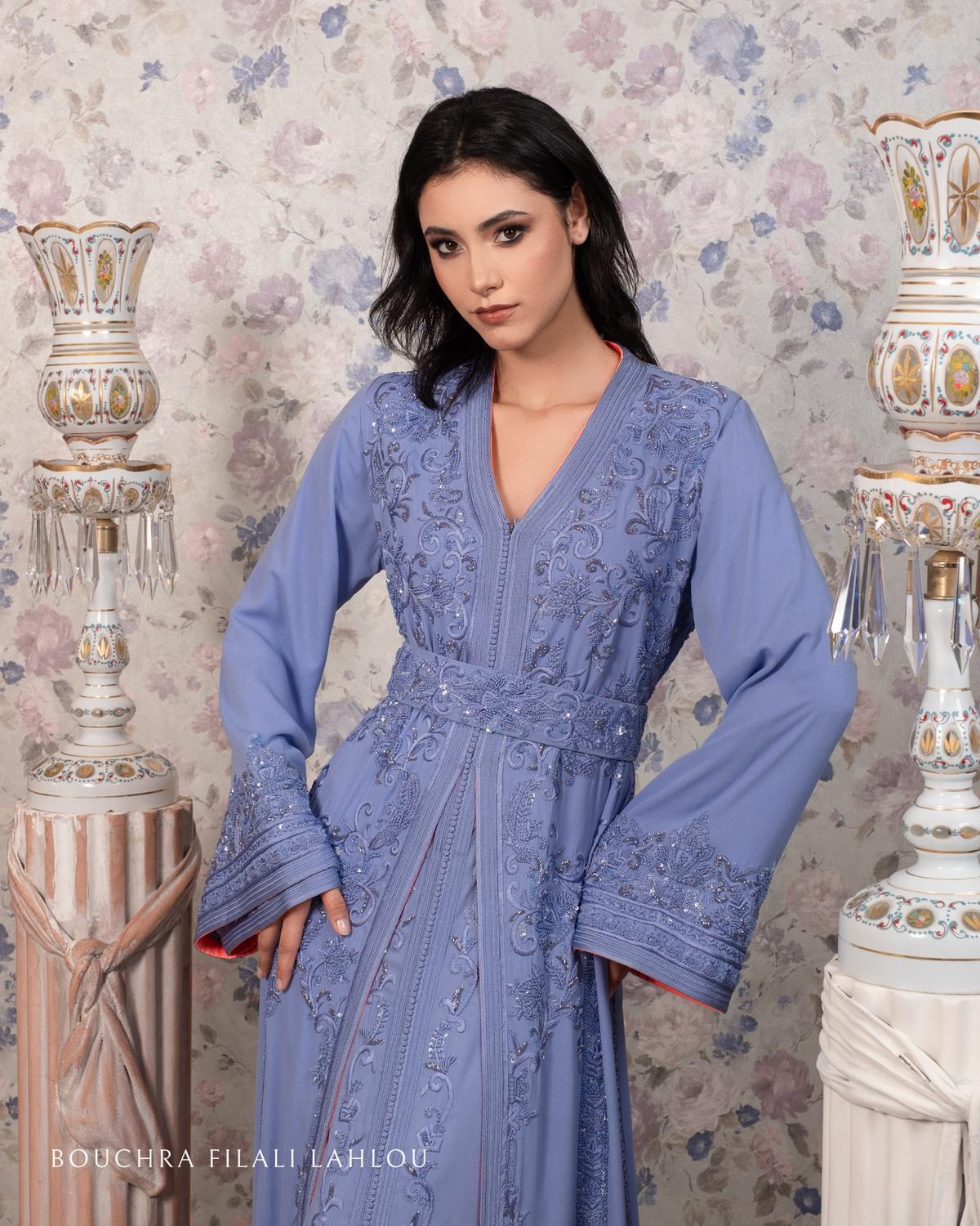 Model wearing a luxury embroidered lilac caftan by Bouchra Filali Lahlou, detailed with intricate crystal embellishments and elegant belted silhouette