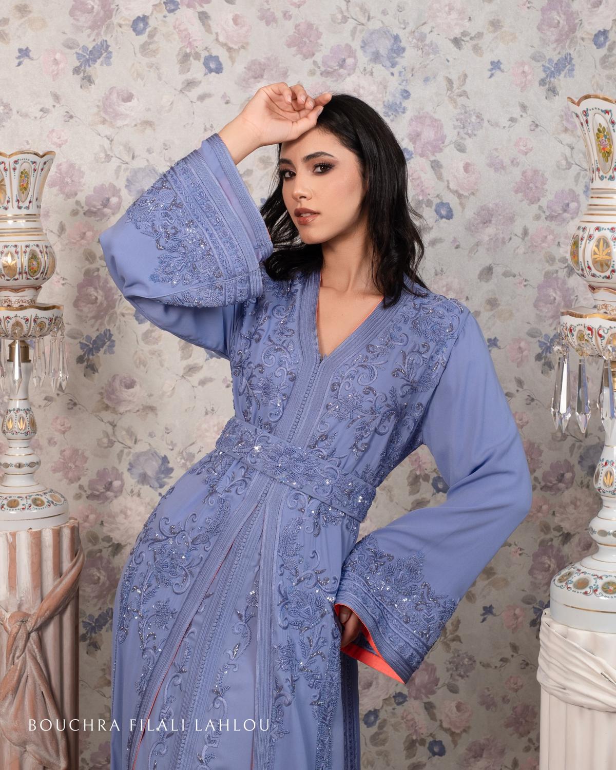 Close-up of haute couture lilac Moroccan caftan with artisanal embroidery and flared sleeves by Bouchra Filali Lahlou
