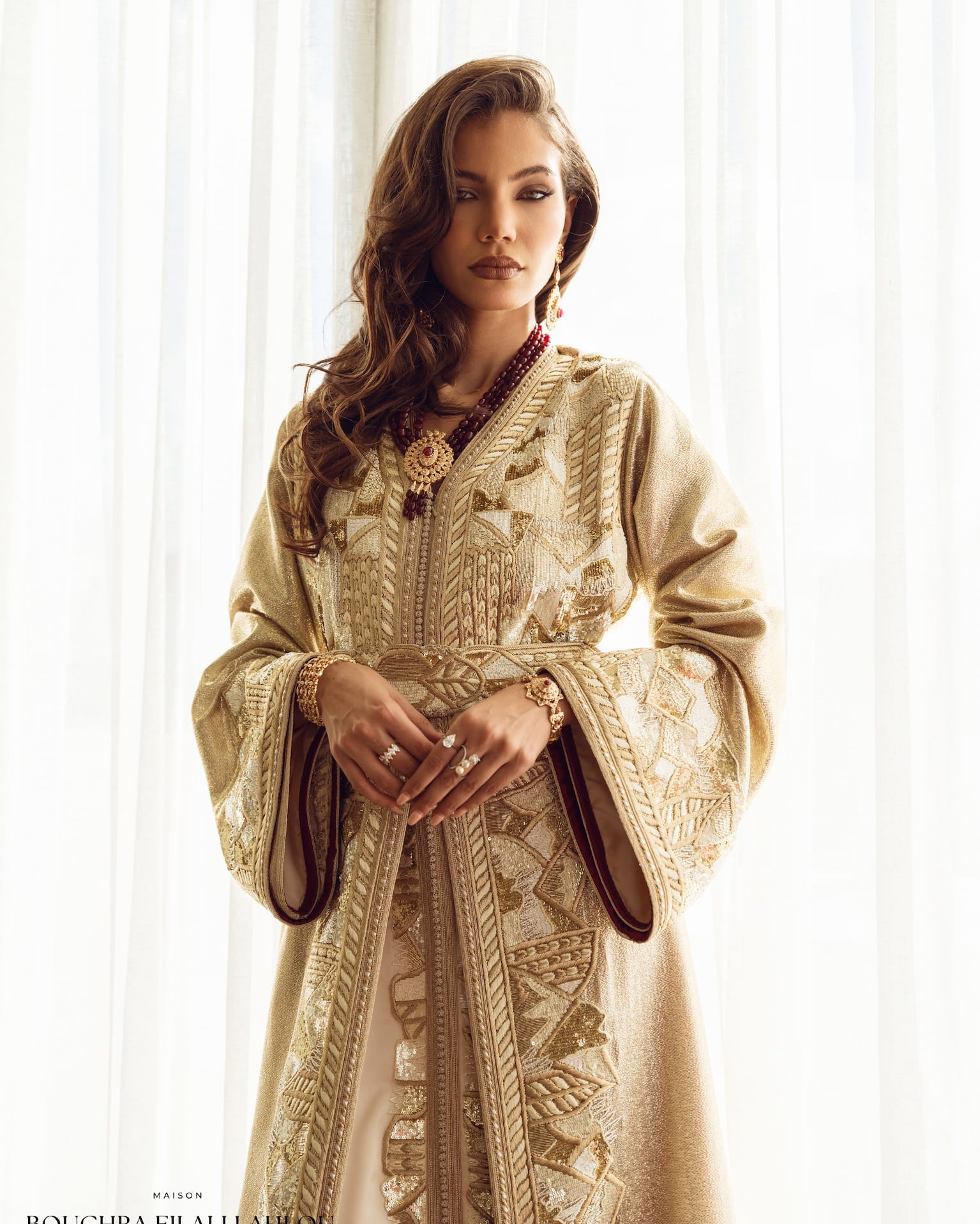 Soft gold couture Moroccan kaftan with embroidered belt and wide sleeves, front view