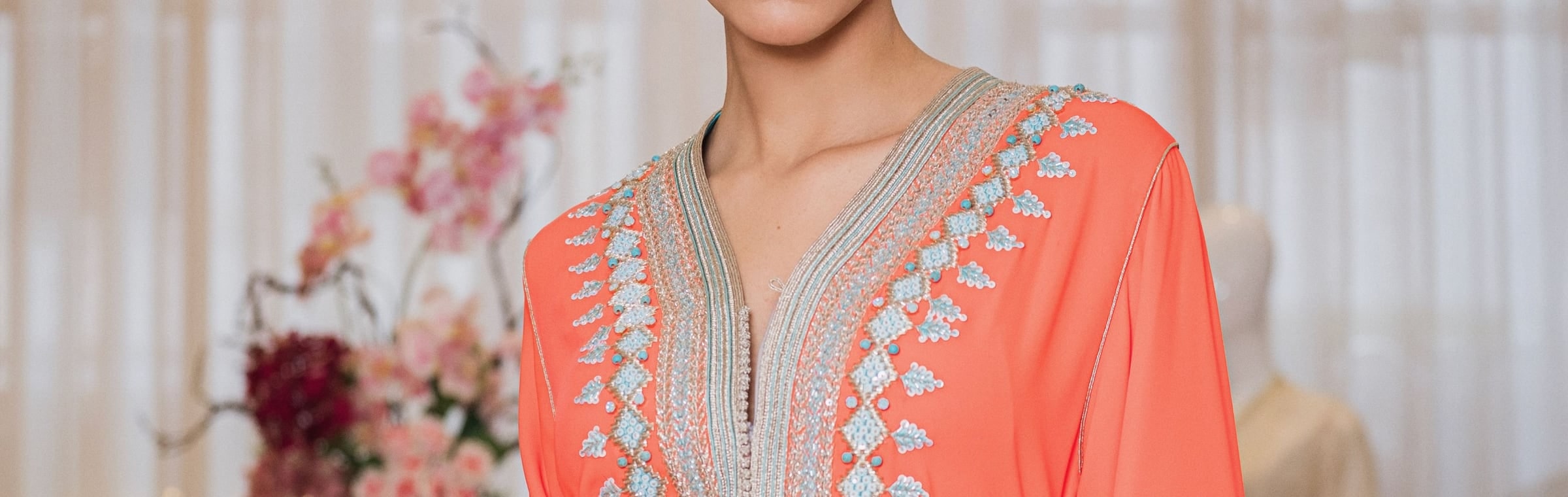 Silver tartan one-piece Moroccan caftan with a hand-worked braid down the placket and a red velvet belt