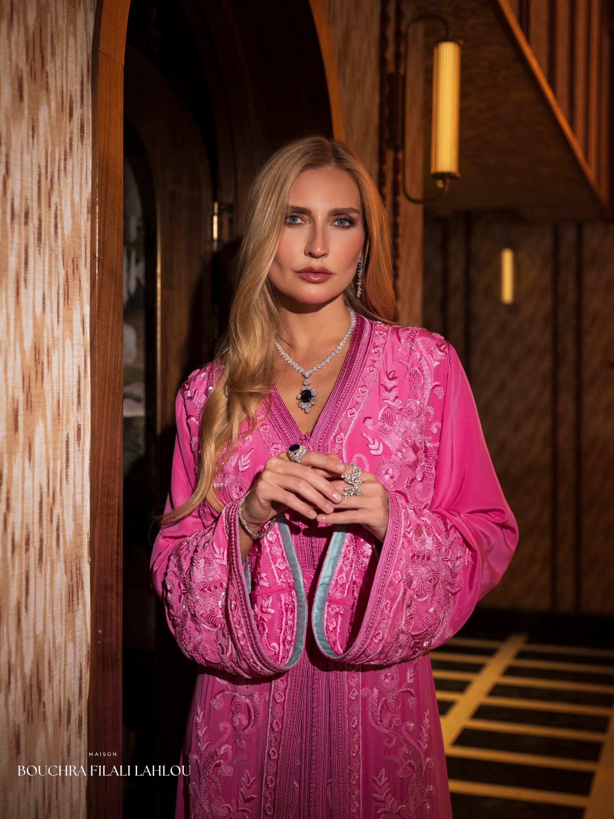 Fuchsia Moroccan caftan detail with pale blue sleeve lining and ornate embroidery