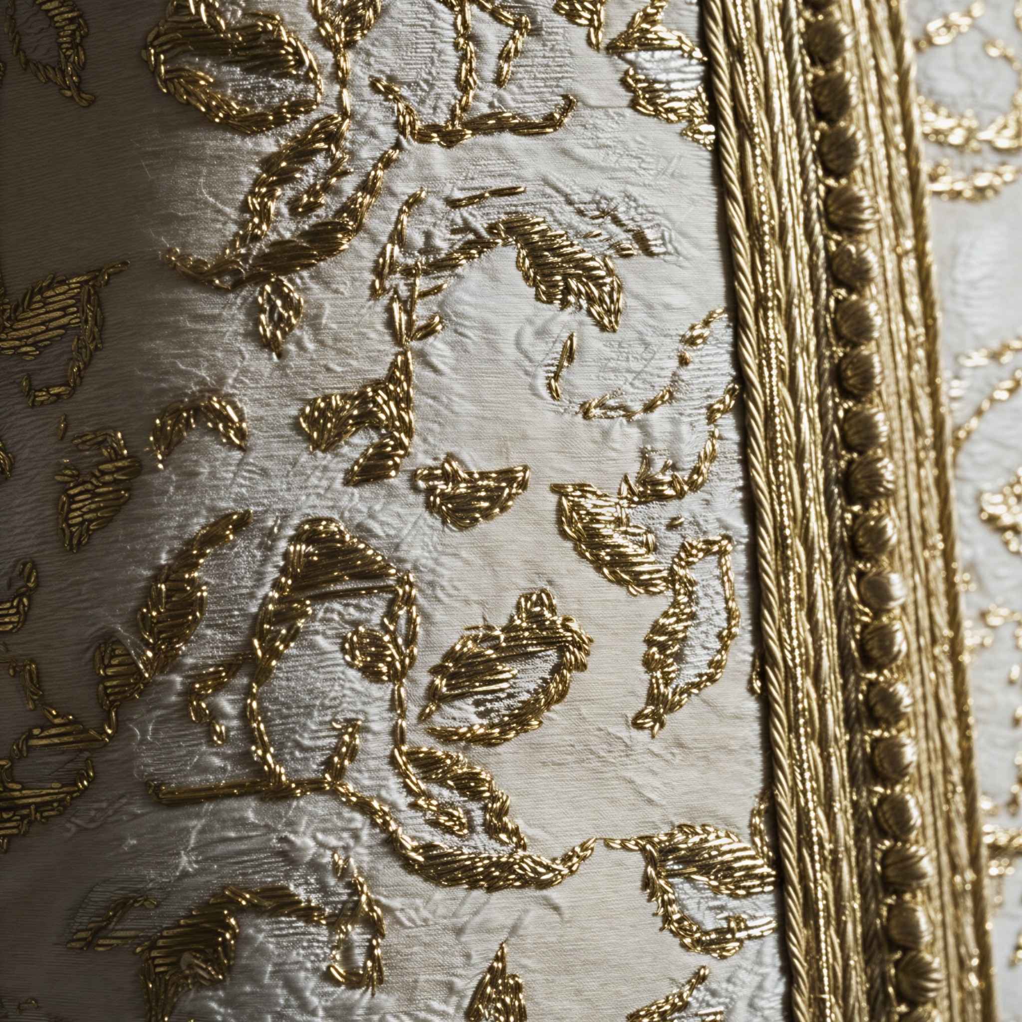 Ivory Dawn kaftan close-up of gold embroidered motifs on ivory fabric