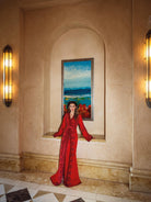 Red Moroccan kaftan with tonal embroidery and belted couture silhouette